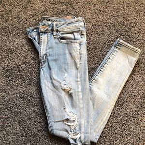 AE light wash holey jeans